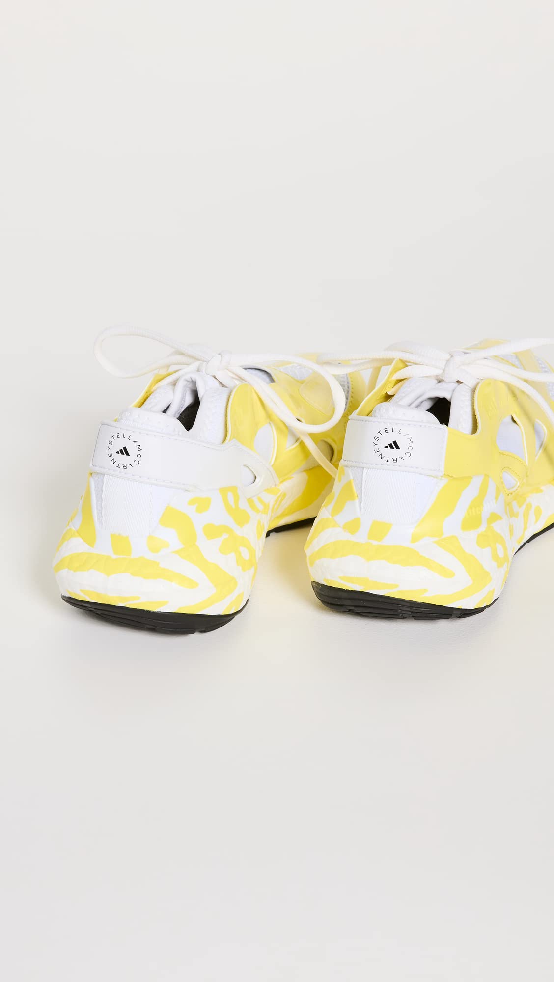 adidas by Stella McCartney Women's Ultraboost 22 Graphic Sneaker, Shock Yellow/FTWR White, 9.5 Medium US