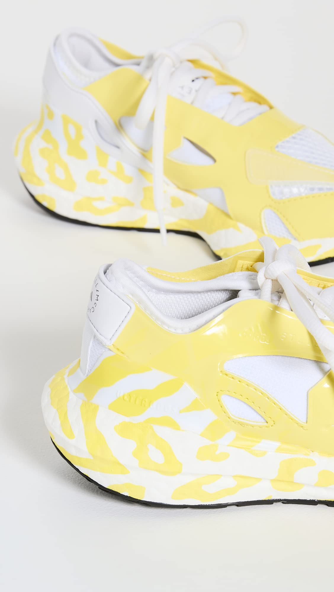 adidas by Stella McCartney Women's Ultraboost 22 Graphic Sneaker, Shock Yellow/FTWR White, 9.5 Medium US
