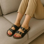 CUSHIONAIRE Lang Slip On Cork Footbed Womens Sandals β Comfortable Slides with Adjustable Buckle Flat Sandals for Women 2025, BLACK 7