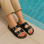 CUSHIONAIRE Lang Slip On Cork Footbed Womens Sandals β Comfortable Slides with Adjustable Buckle Flat Sandals for Women 2025, BLACK 7