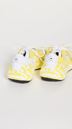 adidas by Stella McCartney Women's Ultraboost 22 Graphic Sneaker, Shock Yellow/FTWR White, 9.5 Medium US