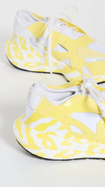 adidas by Stella McCartney Women's Ultraboost 22 Graphic Sneaker, Shock Yellow/FTWR White, 9.5 Medium US