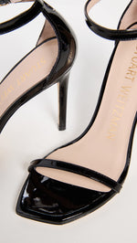 Stuart Weitzman Women's Nudist Curve 100 Patent Sandals, Black, 8.5 Medium US